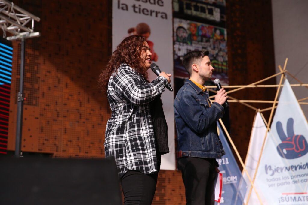 Vaneska Viloria and Alejandro Velasco on stage at the Hola America festival